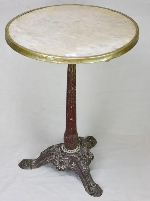 Pretty early twentieth century French bistro table with marble top and cast iron base